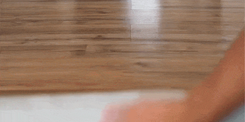 Someone effortlessly unrolling the runner and it immediately laying flat, no adjustments needed